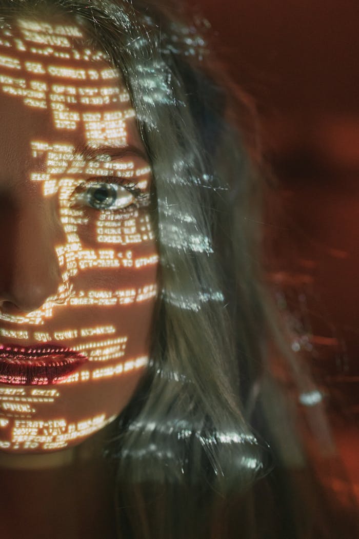 woman-with-text-projected-on-her-face-5473957